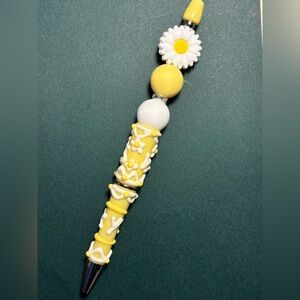 Yellow and White Decorative Pen